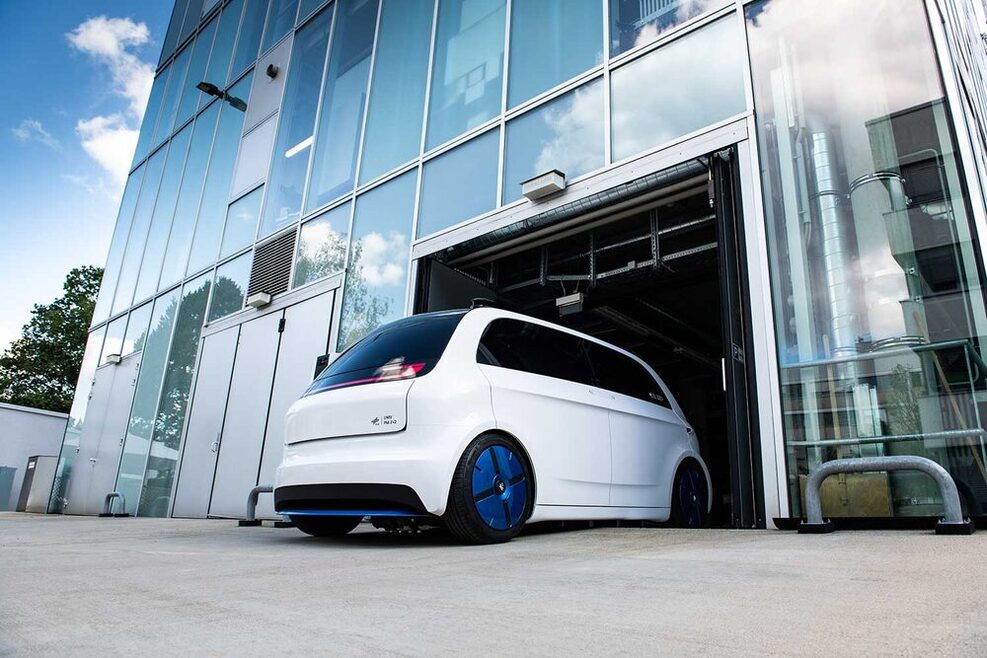 White city car developed by the German Aerospace Center. It's called an Urban Modular Vehicle.